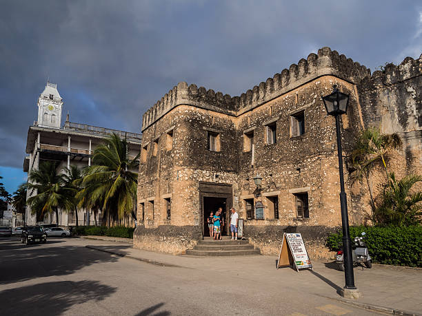Tourists exploring the Old Fort on a Stone Town tour in Zanzibar before comparing Stone Town tour costs and guided experiences