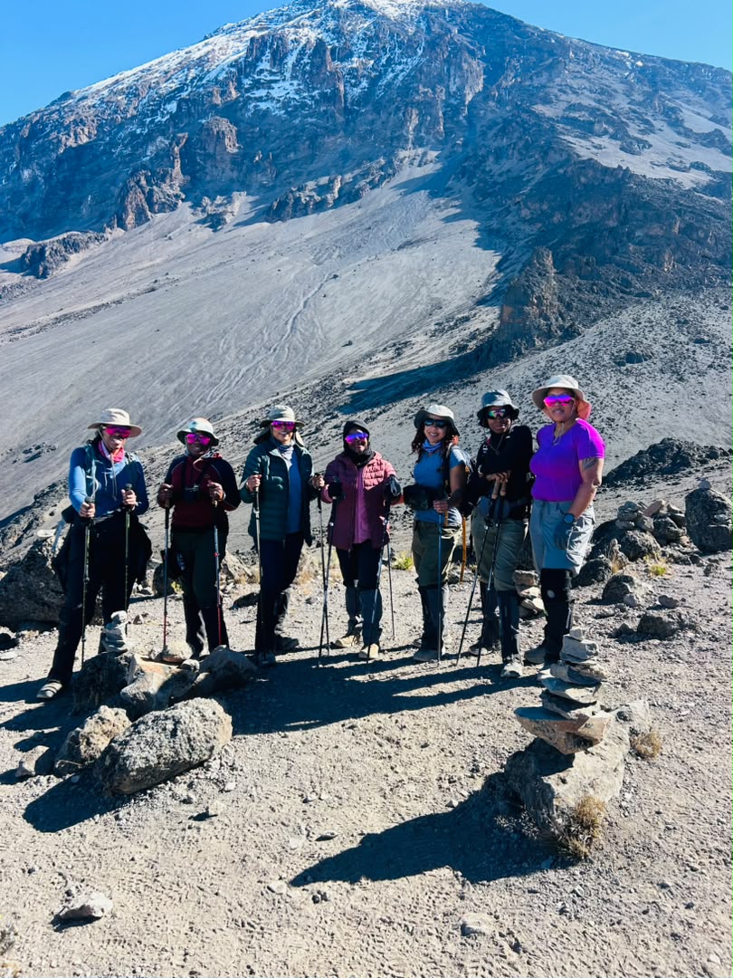 Kilimanjaro for Beginners – first-time female climbers posing with trekking poles on the Lemosho Route during their Mount Kilimanjaro adventure.