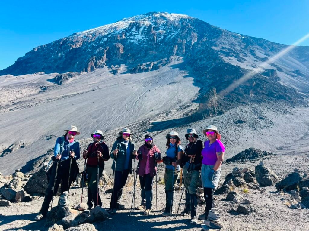 Group of trekkers taking a memorable photo together on Mount Kilimanjaro, Tanzania
