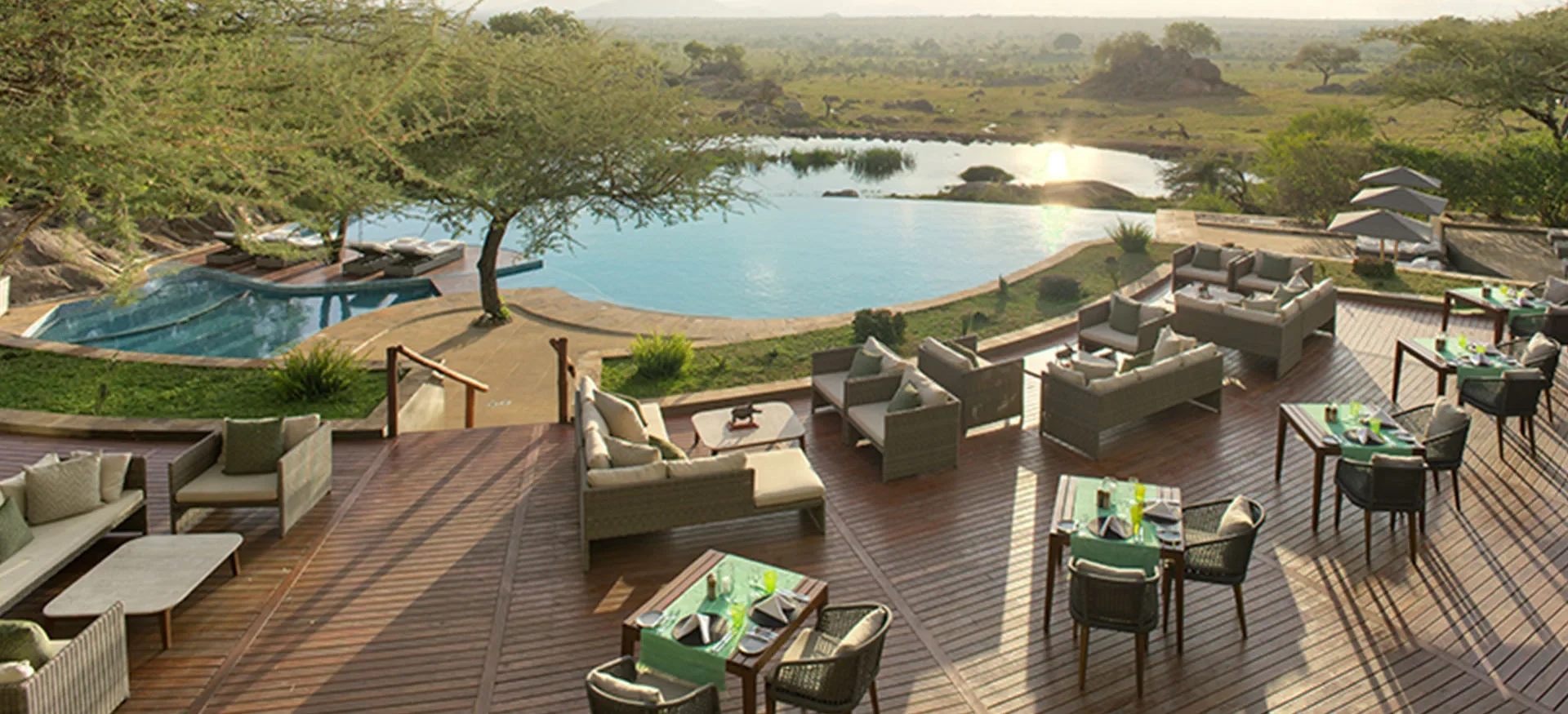 Four Seasons Safari Lodge Serengeti Waterhole View Room overlooking the wildlife waterhole